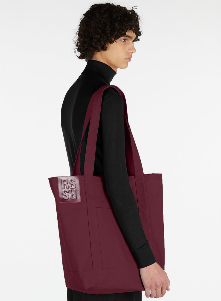 RAF SIMONS SMALL DENIM TOTE BAG WITH LEATHER BADGE – History
